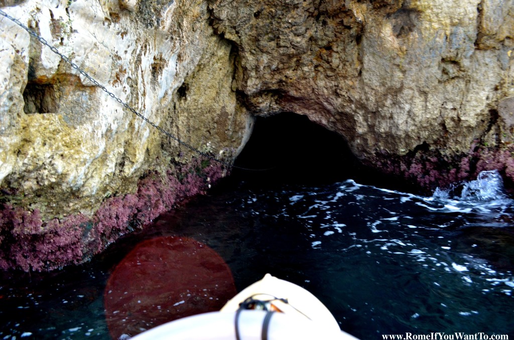 The way into the Blue Grotto is through this hole, on this little boat. The boat rower grabs the chain and pulls you in.